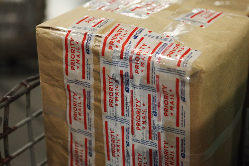 A Priority Mail package is on its way to its receiver after being processed at the Postal Service's sorting facility in Scarborough. Shift changes at the plant have delayed processing of mail in recent days.