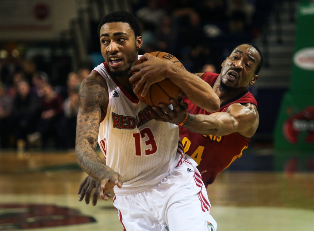 James Young, a Celtics first-round choice who scored 31 points Thursday night, muscles past Chris Porter of the Fort Wayne Mad Ants in a 110-106 victory at the Expo. Whitney Hayward/Staff Photographer 
