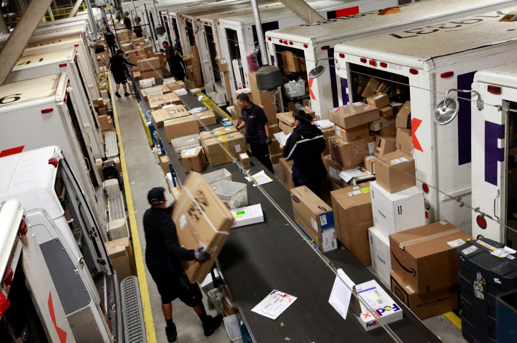 FedEx workers tag and sort packages Dec. 15, the busiest shipping day of the year, at a FedEx facility in San Francisco, Calif. Laura A. Oda/Bay Area News Group/Tribune News Service