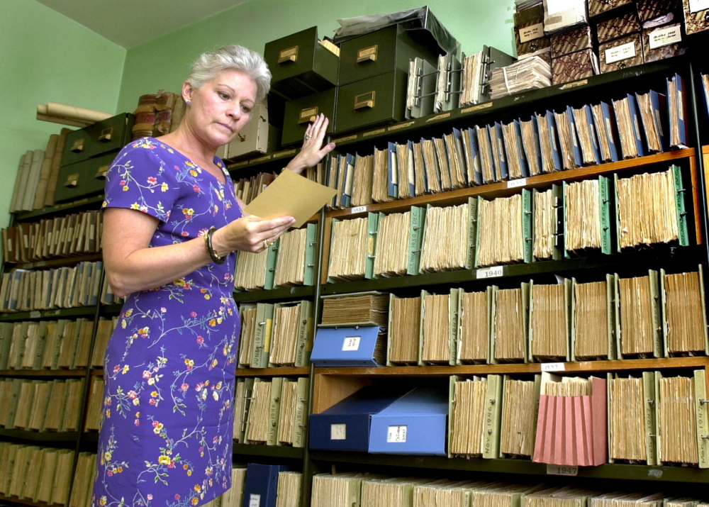Linda Cohen, shown retrieving a document when she was Portland’s city clerk in 2002, has won awards for her integrity and professionalism and is president of the South Portland/Cape Elizabeth Chamber of Commerce.
