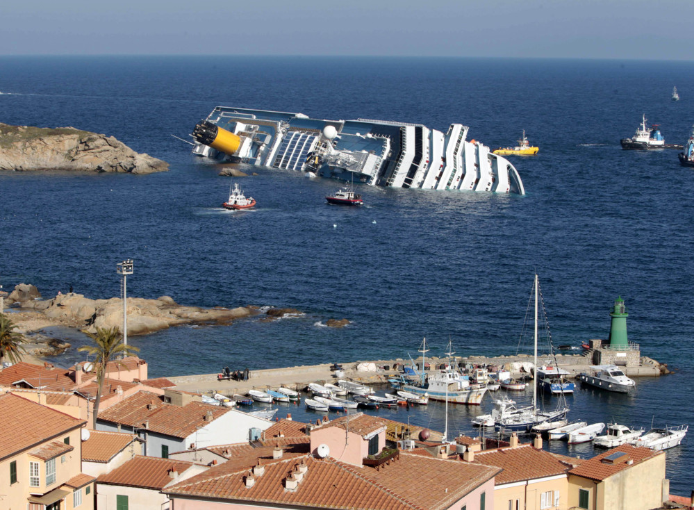 The cruise ship Costa Concordia rests on its starboard side after running aground in 2012 on the tiny Tuscan island of Giglio, Italy. The accident left 32 people dead.