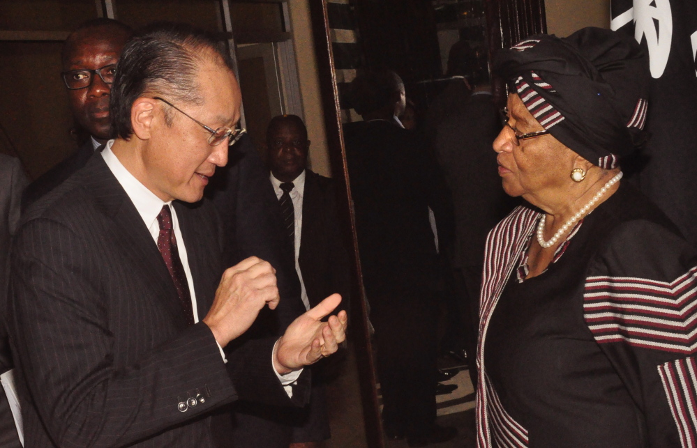 World Bank President Jim Yong Kim speaks to Liberian President Ellen Johnson Sirleaf in Monrovia on Tuesday.
