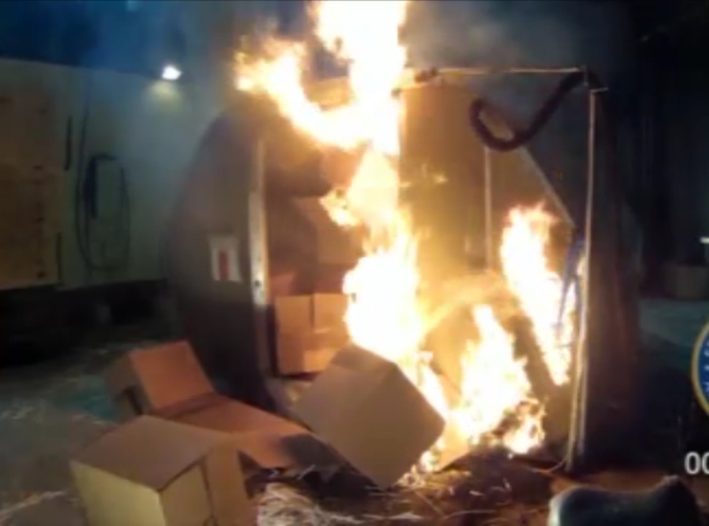 This frame grab shows the results of a test at the FAA’s technical center in Atlantic City, N.J., after a cargo container was packed with 5,000 lithium-ion batteries. The batteries power products from cellphones and laptops to hybrid cars.