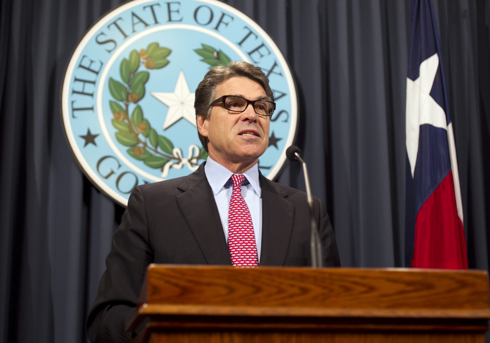 Texas Gov. Rick Perry speaks during a news conference on Wednesday at the Capitol in Austin. Texas is leading a coalition of mostly Southern and Midwestern states suing the Obama administration over executive orders on immigration.