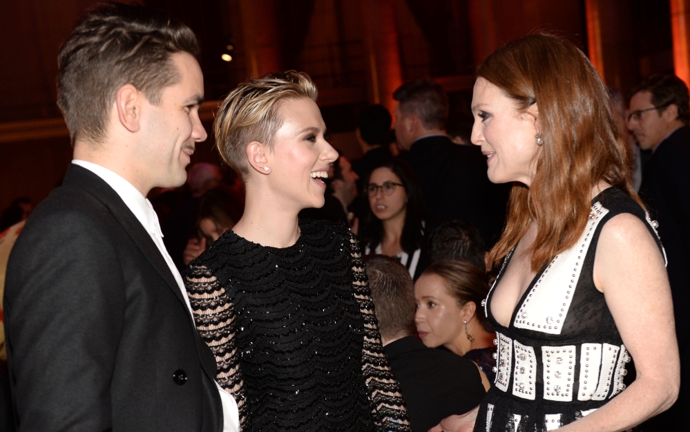 Romain Dauriac, Scarlett Johansson, center, and Julianne Moore attend the Gotham film awards Monday in New York.