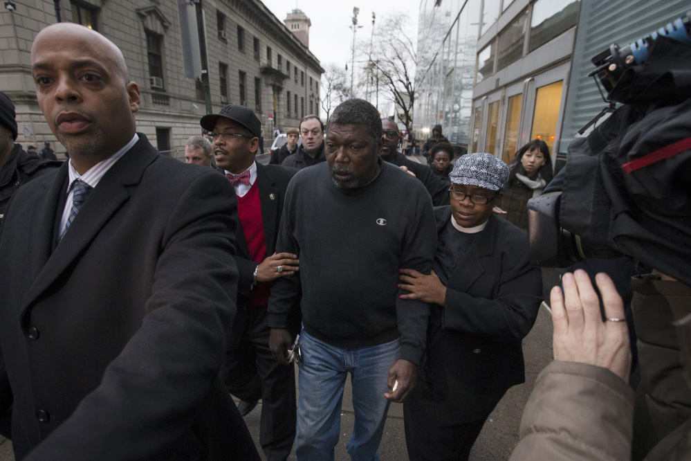 Benjamin Carr, the stepfather of Eric Garner, leaves the district attorney’s office Wednesday after a grand jury’s decision not to indict a New York police officer who was involved in Garner’s death. A video shot by an onlooker and widely viewed on the Internet showed Garner telling officers to leave him alone as they tried to arrest him. The city medical examiner ruled Garner’s death a homicide and found that a chokehold contributed to it.