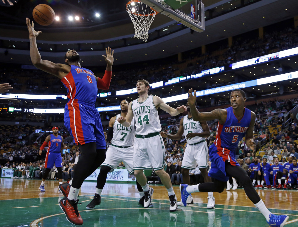 Detroit Pistons guard Kentavious Caldwell-Pope watches as center Andre Drummond gathers in a rebound against Boston Celtics center Tyler Zeller (44) and forward Jared Sullinger during the first half of Wednesday night’s game in Boston.