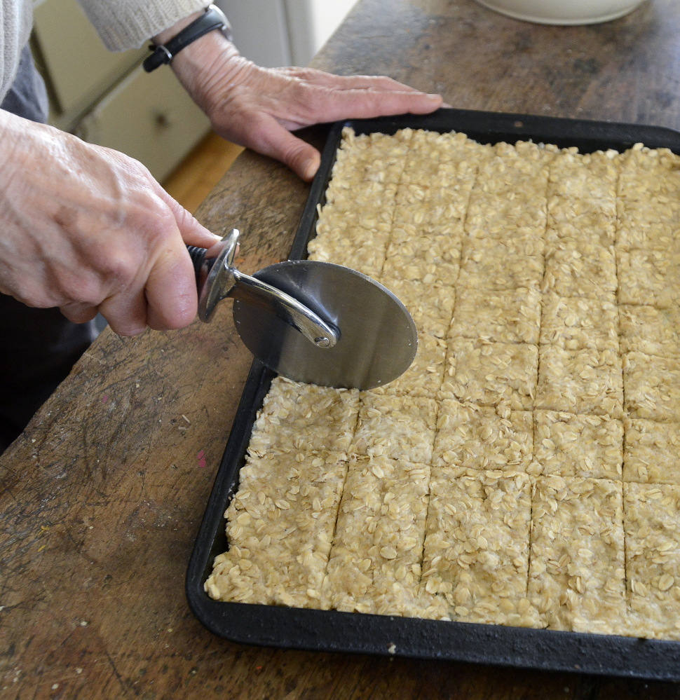 Score the cracker dough before baking.