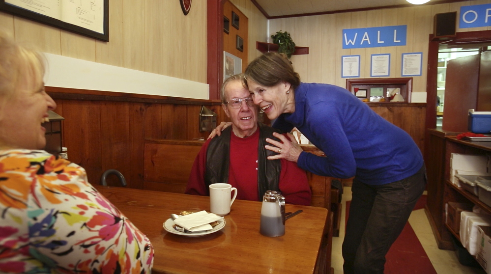 Ebb Tide co-owner Nancy Gilchrist hugs longtime customer Milt Van Vlack on Thursday as she and her husband, Peter, prepare to close the restaurant after operating it 40 years.