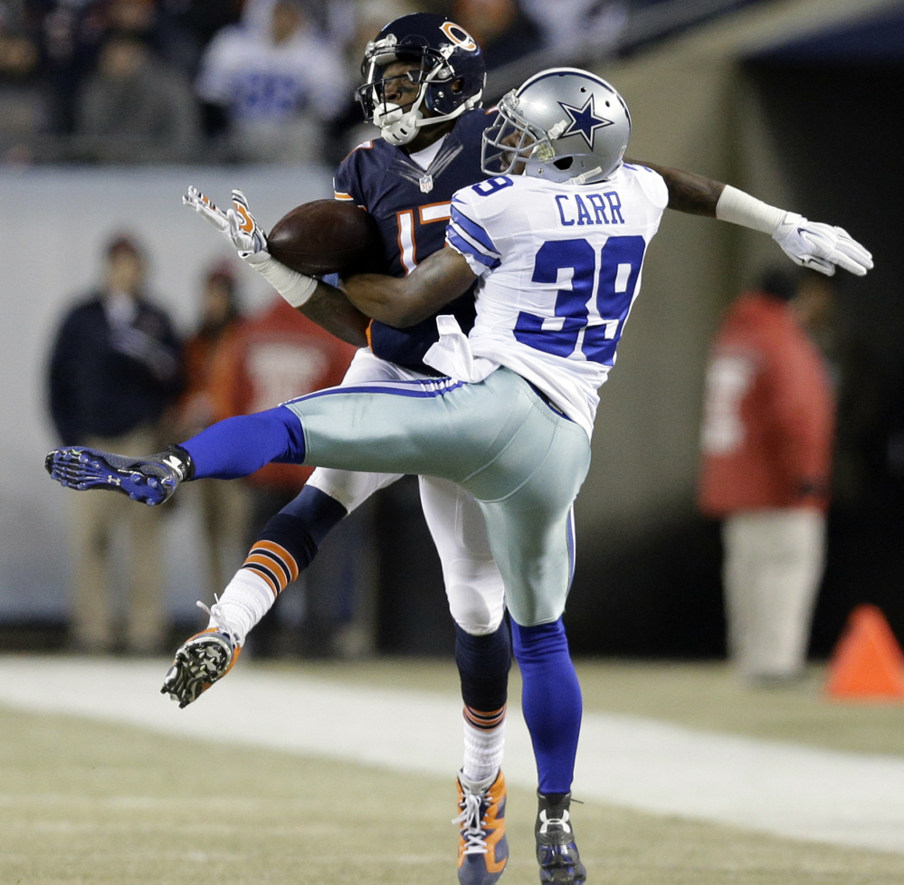 Brandon Carr of the Dallas Cowboys breaks up a pass intended for Alshon Jeffery of the Chicago Bears in the first half of the Cowboys’ 41-28 victory Thursday night.