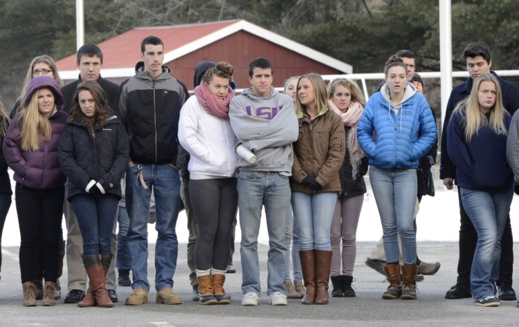 Gray-New Gloucester students watch the crash demonstration outside their school on Friday.