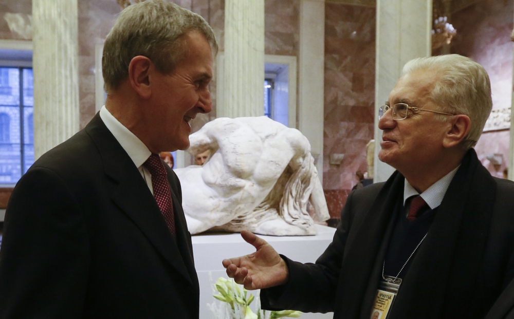Hermitage director Mikhail Piotrovsky, right, and British Museum director Neil MacGregor confer in front of the sculpture of Ilissos at the exhibition on Greek art.