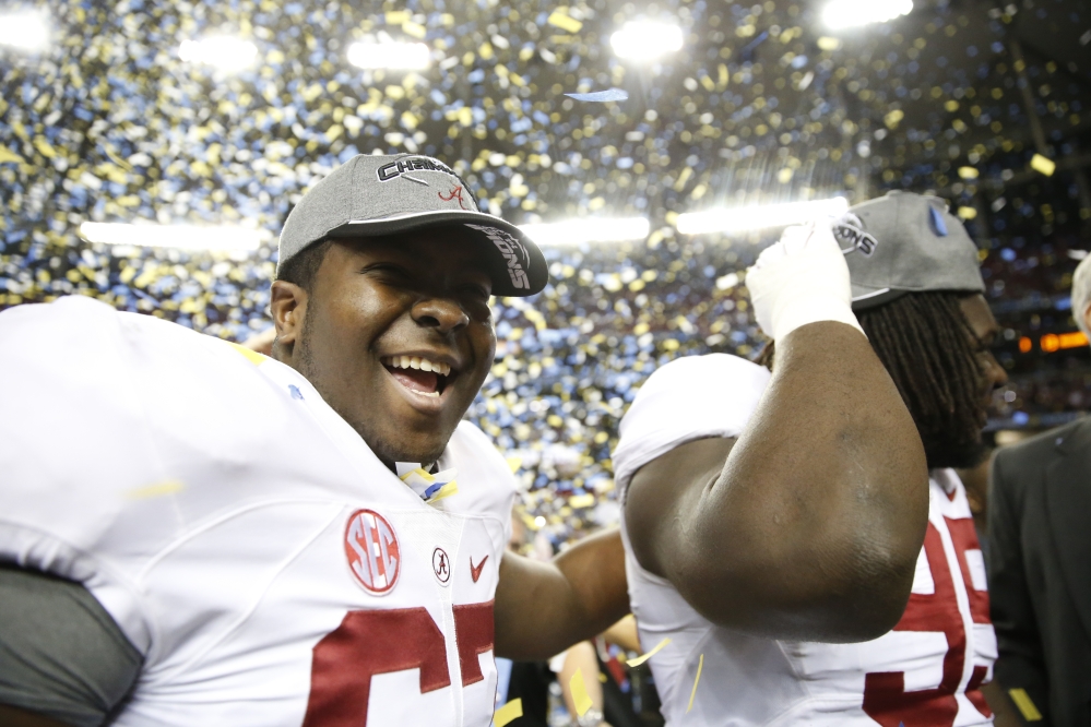 Alabama offensive lineman Josh Casher celebrates after the second half of the Southeastern Conference championship NCAA college football game against Missouri, on Saturday. Alabama won 42-13 and is the top seed in the first College Football Playoff.