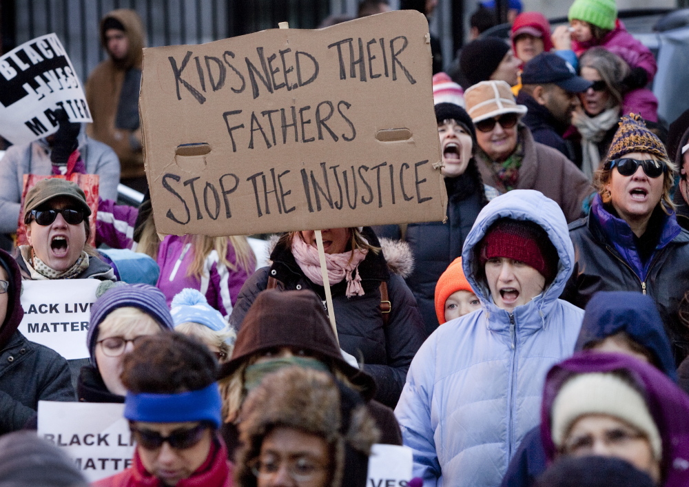 PORTLAND, ME - DECEMBER 7:People march from Congress Square, down Congress Street, to protest  recent police violence around the country, on Sunday, December 7, 2014.(Photo by Carl D. Walsh/Staff Photographer)