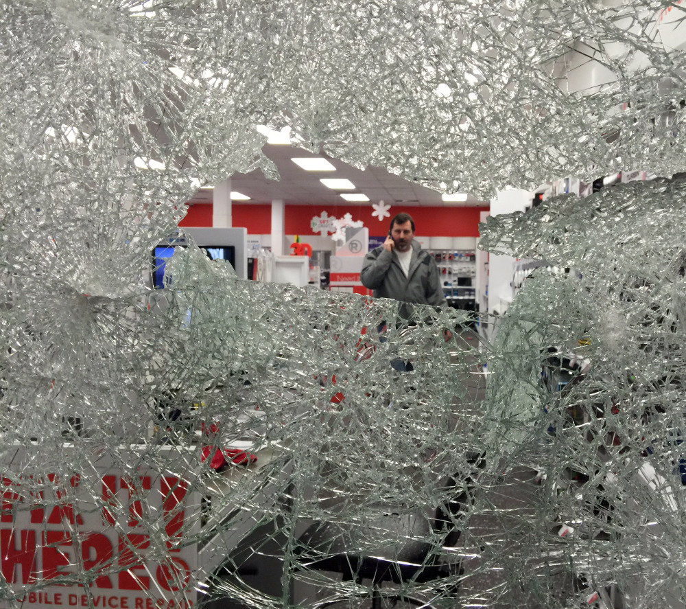 Protesters smashed a window of this Radio Shack in Berkeley and looted the store. A witness said about three dozen people cheered when the window broke. “The whole peaceful protest thing went out the window,” Aakash Agarwal said.
