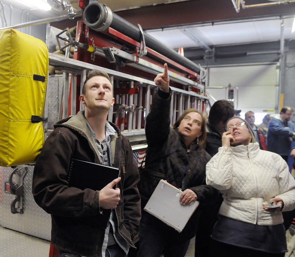 University of Maine at Augusta architecture students tour the interior of the Randolph fire station Monday. 