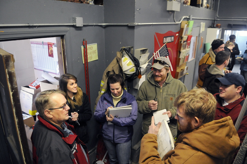The students interview Randolph Fire Chief Ron Cunningham, left, during a tour of the Randolph fire station on Monday.