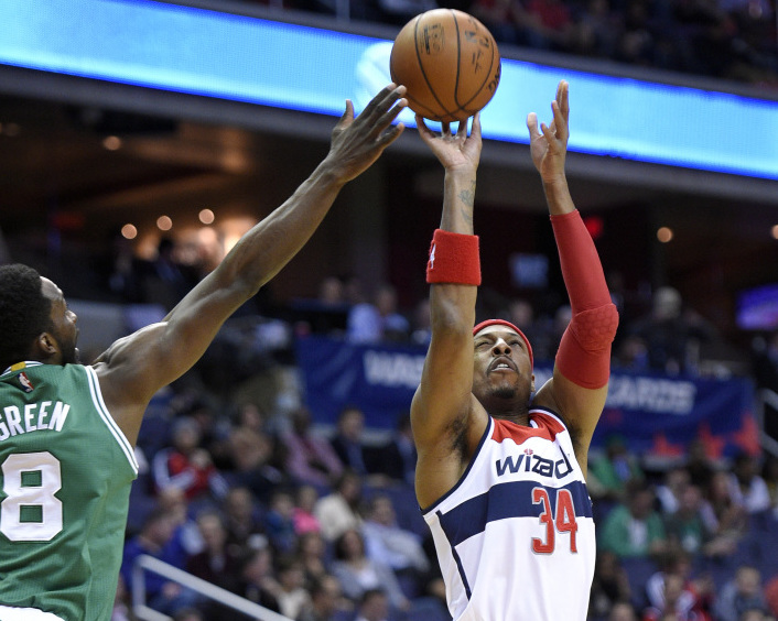Washington Wizards forward Paul Pierce takes a shot against Celtics forward Jeff Green during the first half of Monday night’s game in Washington. Pierce scored a season-high 28 points against his former team in the Wizards’ double overtime win.