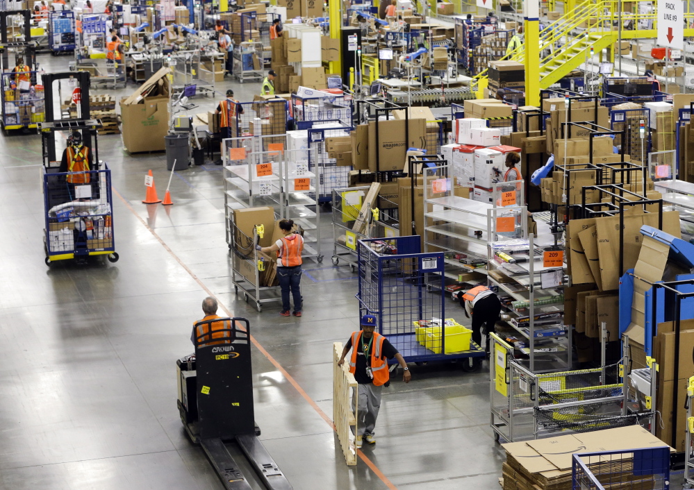 Workers like these at an Amazon fulfillment center in Lebanon, Tenn., are not entitled to pay for their time spent waiting to get through security, the Supreme Court ruled Tuesday.