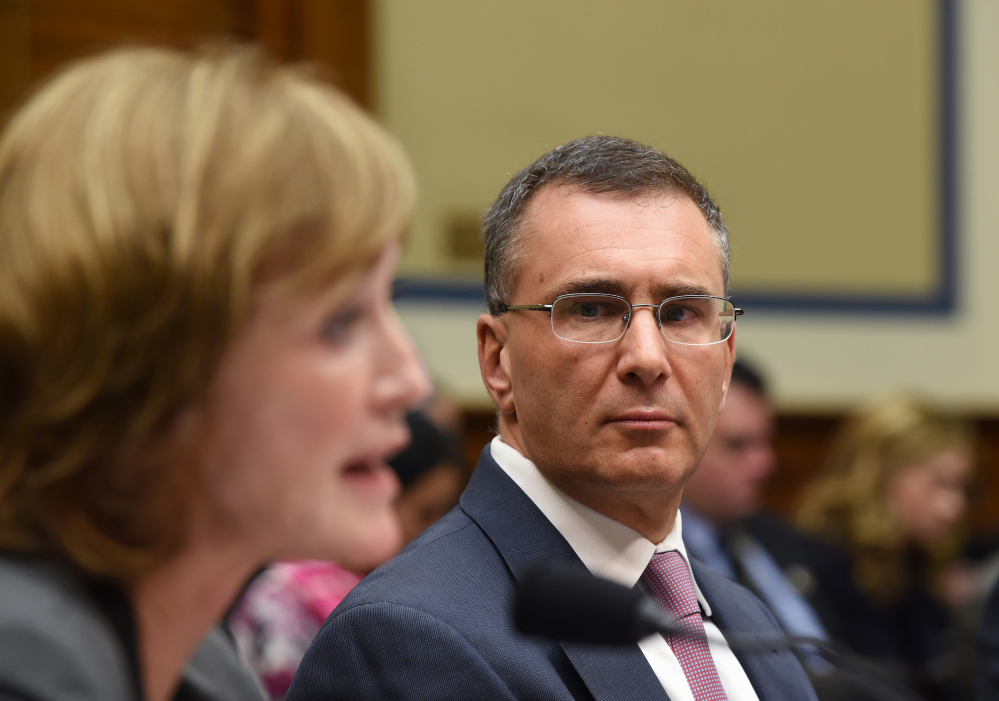 MIT economist Jonathan Gruber, right, listens as Marilyn Tavenner, the administrator of the Centers for Medicare and Medicaid Services, testifies on Capitol Hill in Washington on Tuesday.