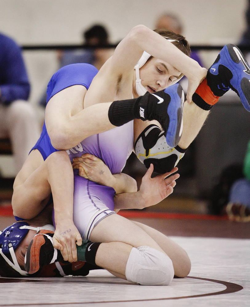 Bradley Beaulieu of Marshwood, on his knees, won the Class A 113-pound title last winter and finished second at the New England qualifier. He is tenacious and a very skilled wrestler as he enters his sophomore year .