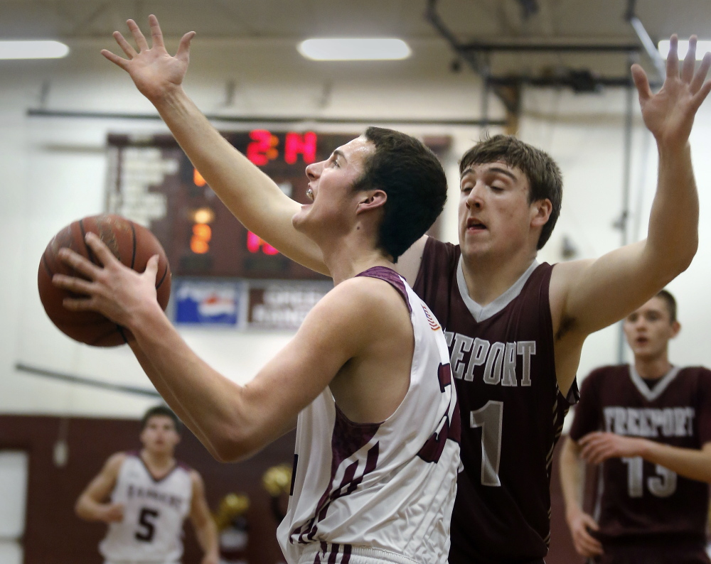 Greely’s Matt McDevitt drives past Freeport’s Matt Nielsen. McDevitt, a sophomore, led the victorious Rangers with 18 points, and will be counted upon this season to help preserve Greely’s rich tradition.