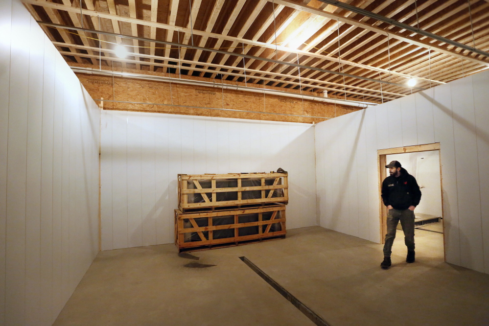 Ryan Wilson, owner of Common Wealth Poultry Co., checks on the construction of a new poultry processing facility.Derek Davis/Staff Photographer