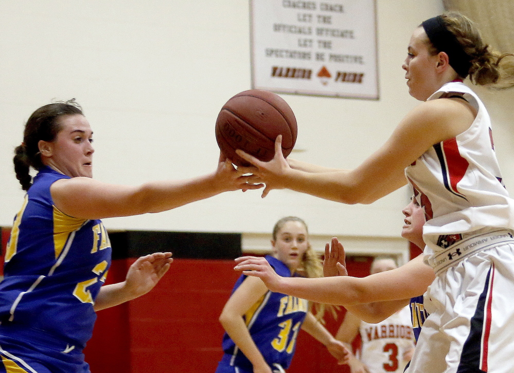 Falmouth’s Jess Burton and Halee Ramsdell of Wells battle for a rebound during a Western Class B girls’ basketball game Thursday night at Wells. Falmouth won 36-26.
