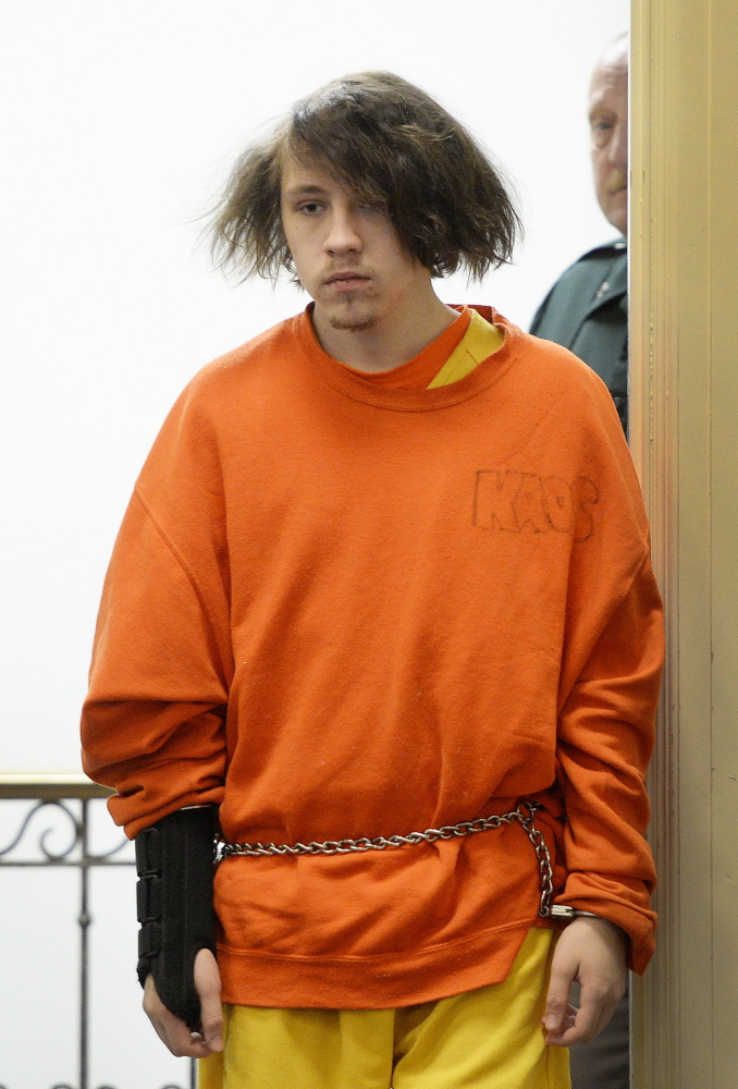 Dylan Collins, 18, of Biddeford, enters York County Superior Court. In a diary entry made public Friday, Collins said he was “sorry” two men died in a fire meant to scare a girl.