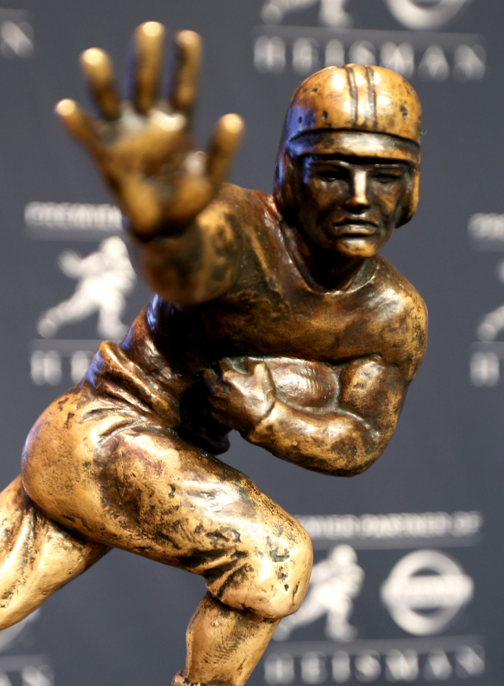 The Heisman Trophy is displayed prior to the announcement of the winner Saturday in New York. The Associated Press 
