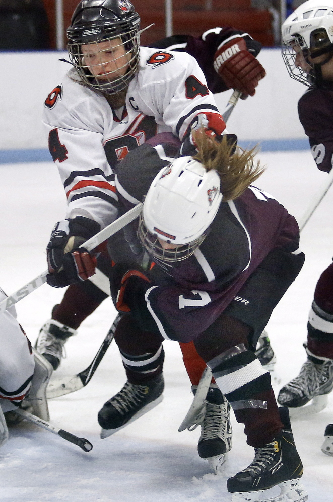 Kristen Murray of Scarborough checks Greely’s Bridget Roberts, drawing the game’s only penalty. Roberts finished with two goals and an assist.