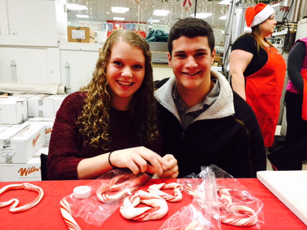 Corinne Latti (a dream recipient candidate for the Dream Factory of Maine) and her brother Mike Latti make candy canes during a fundraiser event hosted by Haven's Candies of Westbrook. The event raised more than $15,785 to sponsor three Maine chronically ill Maine children and fulfill their dream wish in 2015. Photo courtesy Jennifer McBrierty.