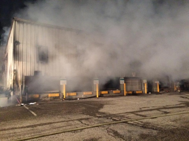 Smoke billows from the Wells transfer station that was heavily damaged by fire early Sunday. Photo courtesy of the Wells Police Department