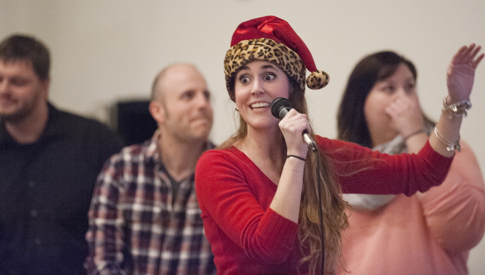 Natalie Simmons, a Mountain Valley High School teacher, leads the four-person improv group Teachers Lounge Mafia as they sing karaoke during a show at the University of Maine at Farmington this month.