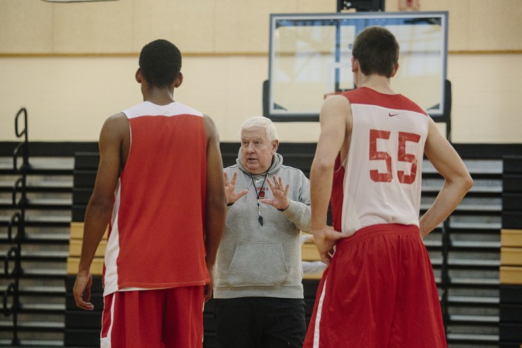 Harvey Moynihan  instructs players on defensive drills during practice at Scarborough High School Monday.