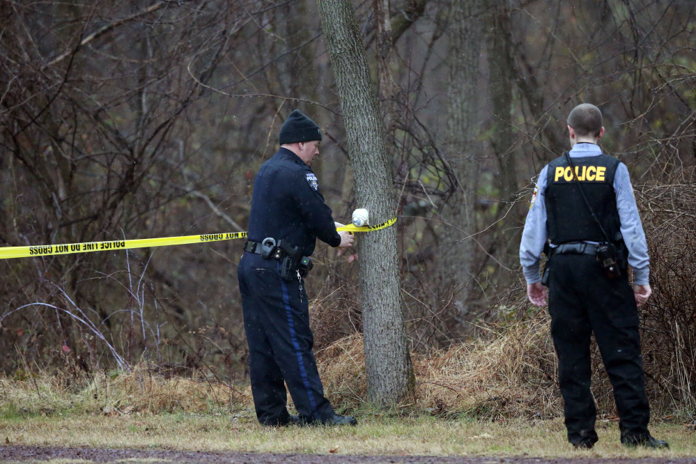 Police cordon off a wooded area during the search for suspect Bradley William Stone, Tuesday, in Pennsburg, Pa.