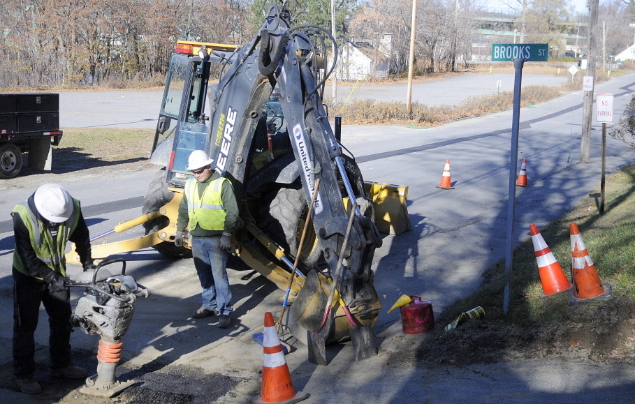 Workers from Tetra Tech Construction, a former contractor for Summit Natural Gas, patch a street in Augusta last year.