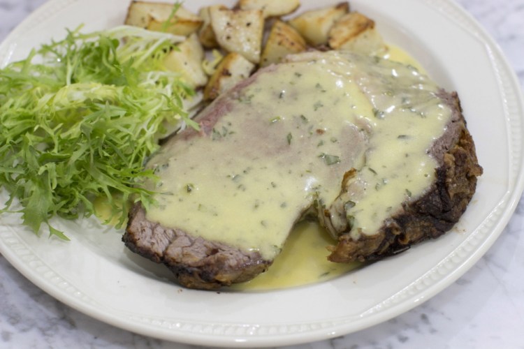 Slow roasted standing rib roast with bearnaise sauce. The reduction for the bearnaise sauce can be made while the roast is in the oven, then finished when the meat is resting.