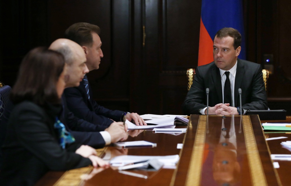 Russian Prime Minister Dmitry Medvedev met with advisers to focus on ways to shore up the ruble. Russia’s central bank hiked an interest rate from 10.5 to 17 percent Monday to stem the flow of money out of the country.