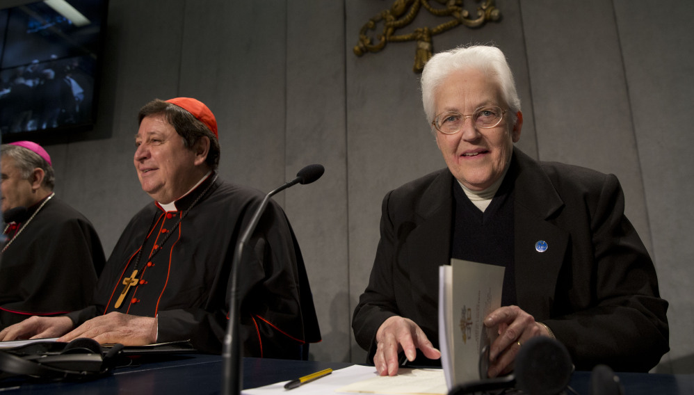 Sister Sharon Holland, right, arrives for a news conference at the Vatican on Tuesday.