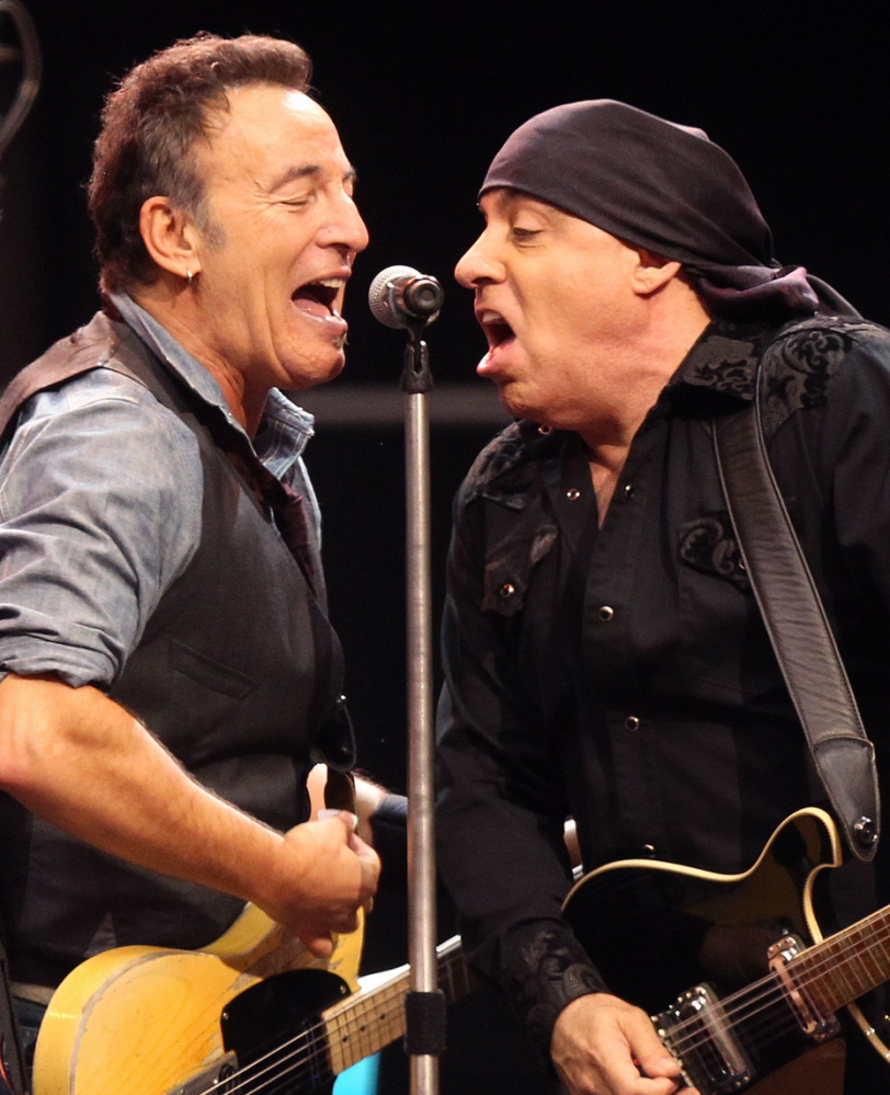 Bruce Springsteen, left, performs with Steven Van Zandt in the E Street Band.
