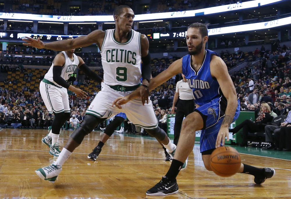 Orlando Magic guard Evan Fournier drives against the Celtics’ Rajon Rondo during the first half of Wednesday night’s game in Boston. Rondo led the way for Boston with 13 points, 15 assists and seven rebounds.