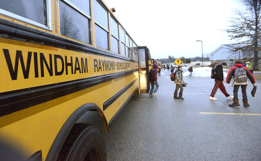 WINDHAM, ME - DECEMBER 18: Middle school students get off the bus as students return to Windham schools after a threat canceled three days of classes. (Photo by John Patriquin/Staff Photographer)