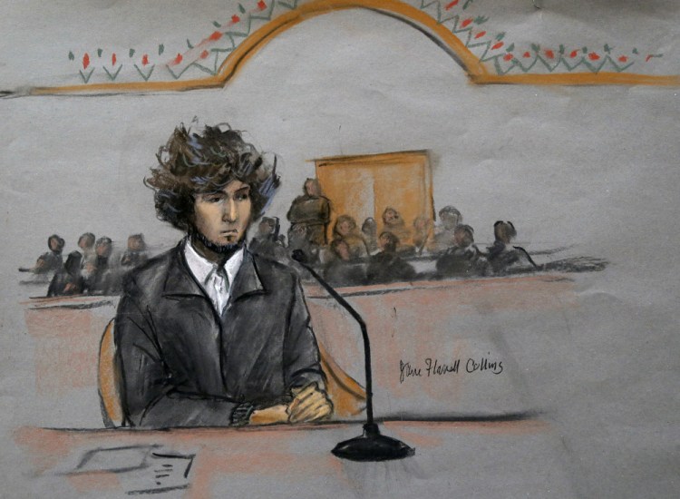 In this courtroom sketch, Boston Marathon bombing suspect Dzhokhar Tsarnaev is depicted sitting in federal court in Boston Thursday, Dec. 18, 2014, for a final hearing before his trial begins in January.