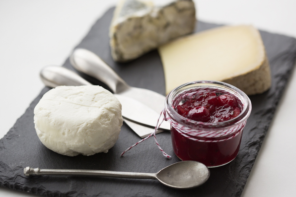 Cranberry, ginger and lemon chutney accompanies local cheeses, clockwise from top, Tide Line from Winter Hill Farm in Freeport, Ragged Island (Hahn’s End) from Phippsburg, and chevre from Seal Cove Farm in Lamoine.
