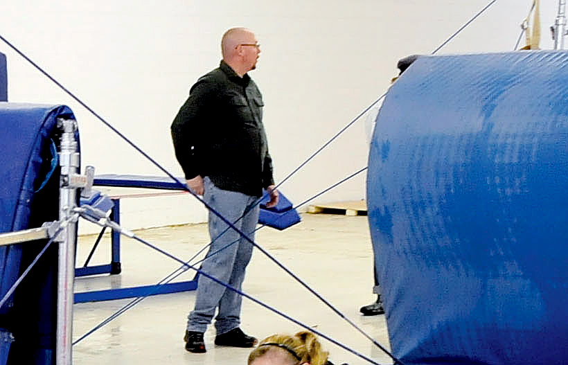 Dennis Hanson, of Wilton, helps clean up water damage at Decal Gymnastics in Farmington last winter. Hanson died in a car accident Thursday in Wilton. His young daughters were avid gymnasts. Members of the club where they trained said Hanson often helped out at the facility where his daughters trained.