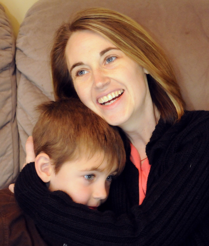 Cyndi MacMaster hugs her son Tripp, 5, at their Dresden home on Dec. 7.  People rallied behind Cyndi and her family after a devastating recurrence of cancer by donating funds to seek alternative treatments. Over $23,000 was contributed on the first day of the Web fundraiser by over 370 people.