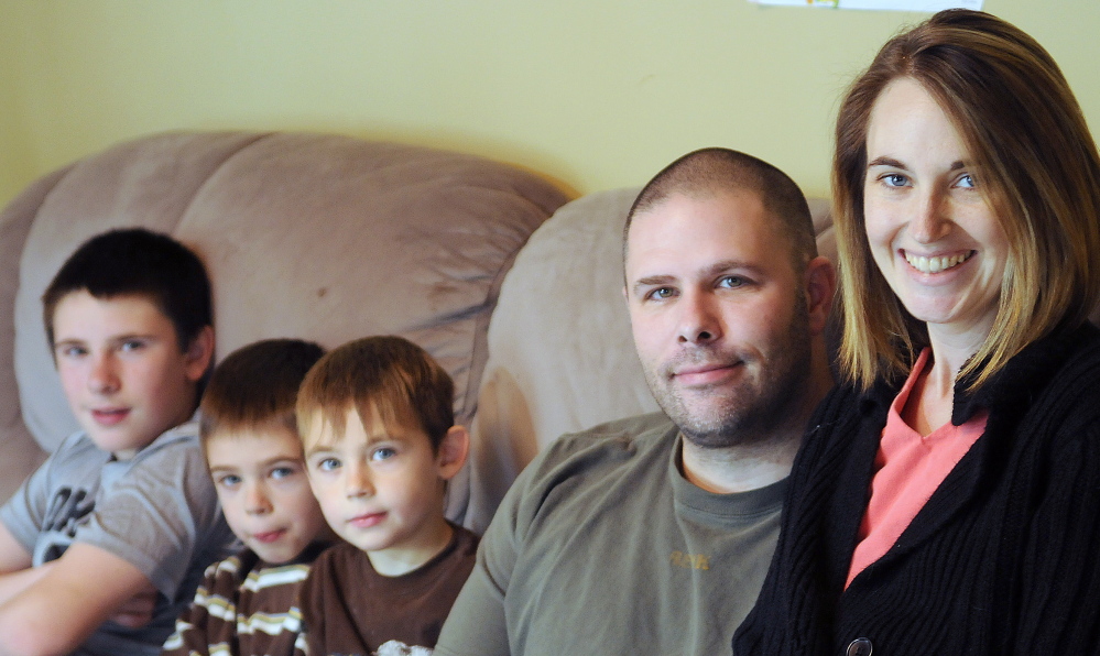 Cyndi MacMaster with her husband, Scott, and sons Tripp, 5, center, Parker, 7, and Jake, 12, at their Dresden home on Dec. 7. Cyndi MacMaster died Friday after battling a second bout of cancer. Fundraisers to help the family will go on, organizers said.