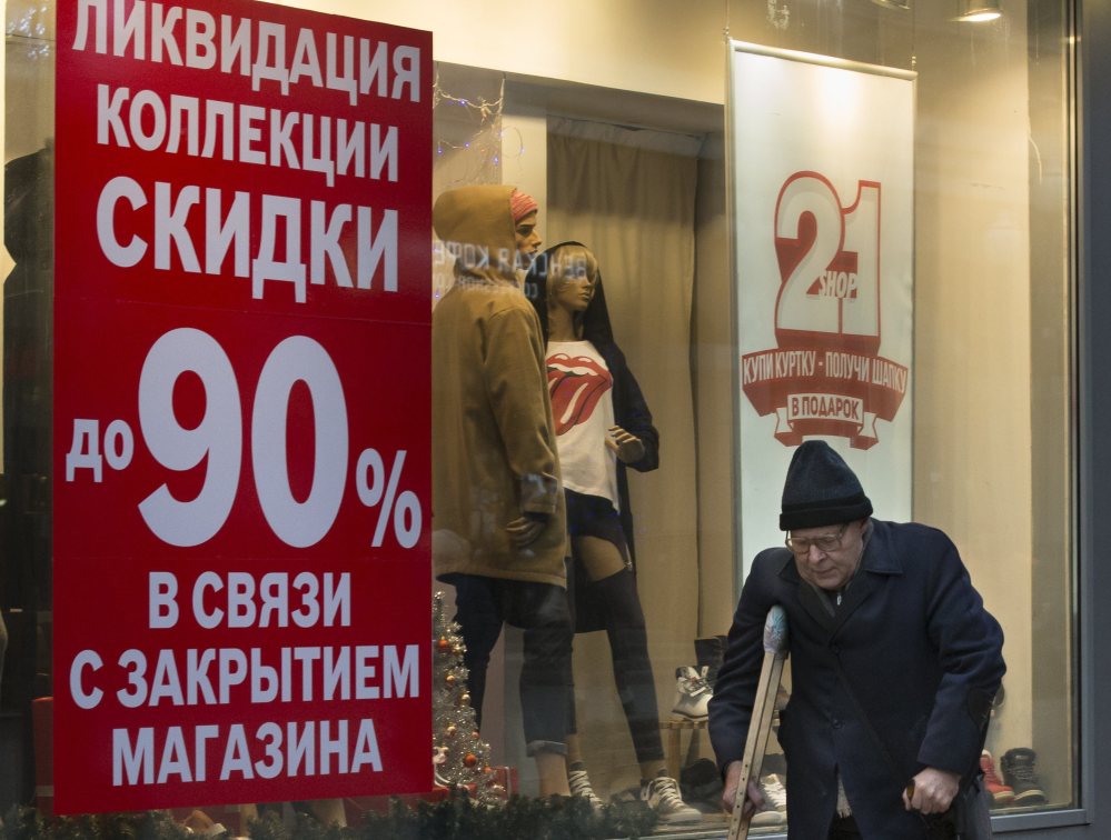 A store in Moscow advertises a 90 percent off sale on Thursday. The Russian economy is stuttering due to pressure from U.S.-led sanctions.