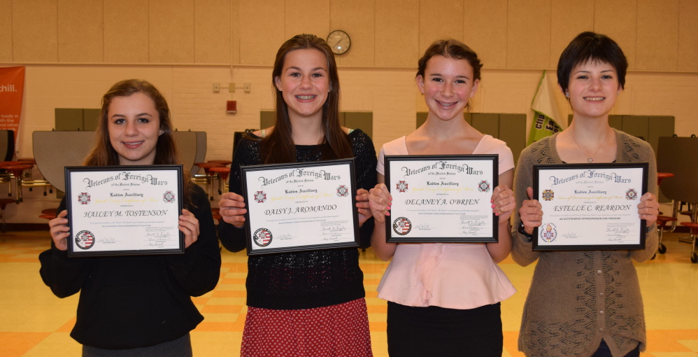Winners of the 2014 “Patriot’s Pen” essay contest include, from left, Wells Junior High School students Hailey Tostenson, Daisy Aromando and Delaney O’Brien. Wells High freshman Estelle Reardon, right, placed second in the “Voice of Democracy” contest.